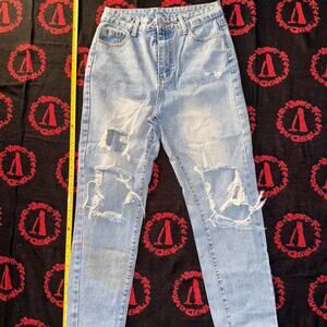 Light wash distressed denim jeans
